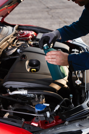 Checking the oil level in a modern carの写真素材