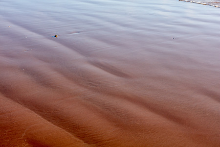 The surface of the water on the beachの写真素材