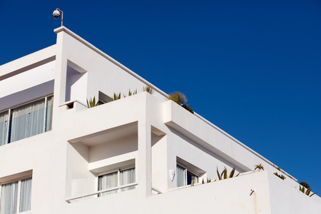 Living house with appartments and balconies in modern arabian style with sky background. Agadir, Moroccoの写真素材