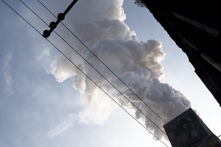 The concept of problems related to environmental pollution. Smoking chimney in a factory