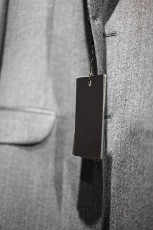 Men's gray high-quality suit and empty tagの写真素材