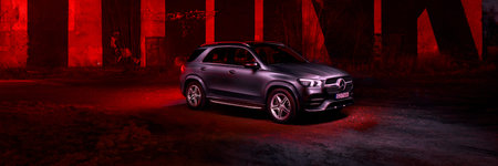 Katowice / Poland - 01/12/2020: Mercedes GLE against the background of a mural by the artist SpY,...