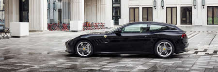 Warsaw, Poland - April 13, 2019: Ferrari GTC4 Lusso in the courtyard of the socialist realist building where once was the seat of the socialist party and today is the Stock Exchange.のeditorial素材