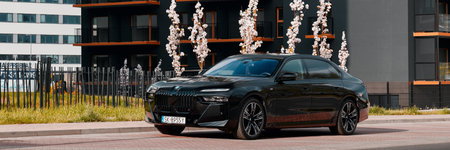 BMW 7 Series, G70, and modern premium limousine. A car on the background of a housing estate. On sale from 2023. Poland, Katowice 03/05/2023のeditorial素材