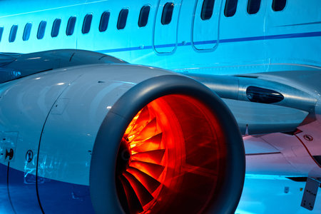 The powerful jet engine of a modern aircraft highlights intricate design and vibrant colors. This...