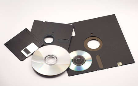 Several floppy disks and CD-ROMsの写真素材