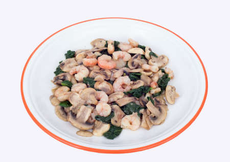 Mushrooms, spinach and prawns.の写真素材