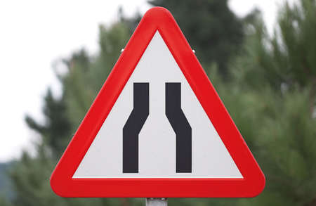 traffic narrow road signの写真素材