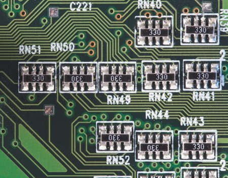 close-up of microcircuit with some conductors and resistorsの写真素材