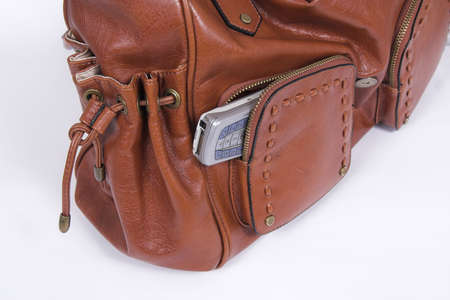 pocket of  woman purse and cell phone insideの写真素材