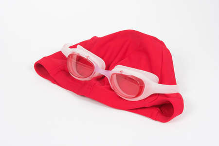 red swimming cap and plastic glassesの写真素材