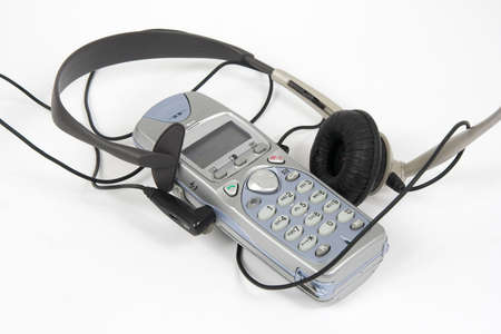 wireless phone with pluged headphone and microphoneの写真素材