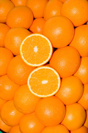 a pile of oranges at the marketの写真素材
