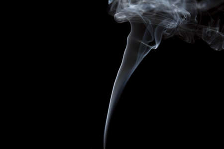 Smoke volutes on a pure black backgroundの写真素材
