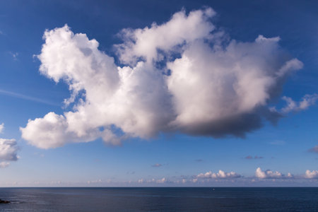 Landscape of a big cloud over the sea in spainの写真素材