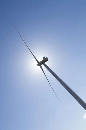 Wind turbine covering the sunの写真素材
