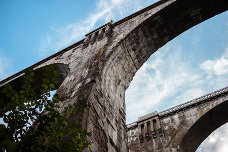 tall bridges against the sky photographed from belowの写真素材