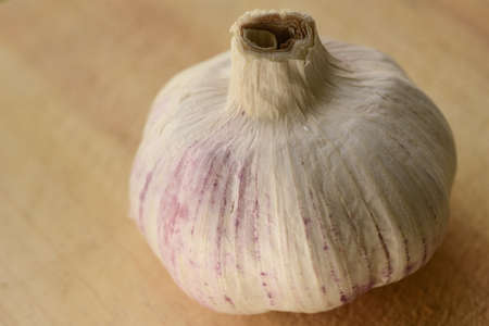 Nice Close up of garlic on a wooden chopping boardの写真素材