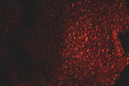 Macro close up portrait of organic crashed dry chile, studio lighting, selective focus