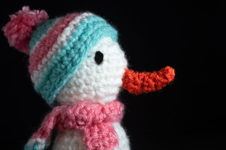 Close up of a Homemade Yarn Snowman worsted, stay home Christmas covid concept