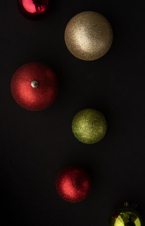 Christmas ornaments baubles are decorations usually made of blown glass, metal, wood, blown plastics, expanded polystyrene or ceramics that are used to festoon a Christmas tree. black bacgroundの写真素材