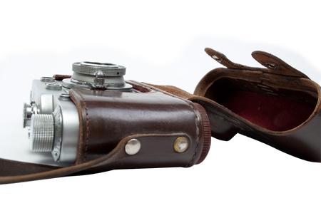 Retro photocamera in a leather case  Object over whiteの写真素材