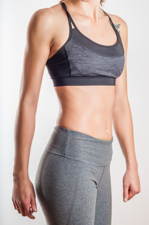 Fit woman body in sportswear on white backgroundの写真素材