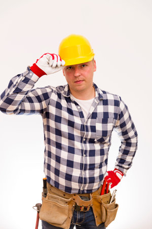 Handyman with a tool belt. House renovation service.