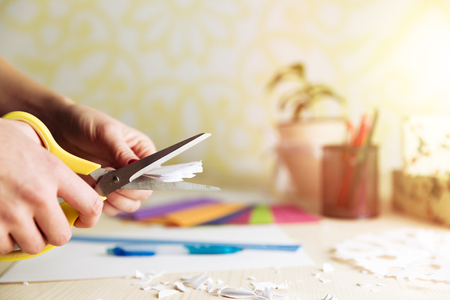 Christmas and New Year decorations. Homemade paper snowflake and scissors. Preparing for Christmas. Holiday craftsの写真素材