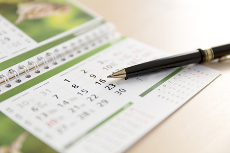 An Image of a calendar and a penの写真素材