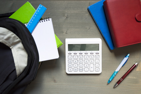 School and learning concept. Backpack with school supplies and calculatorの写真素材