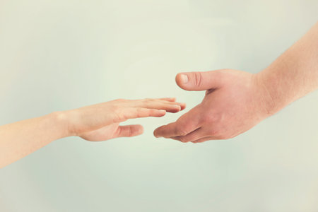 Support concept. Two hands reaching toward each other. Empathy, compassion, help, kindness