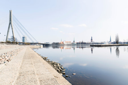 Cityscape in Riga, Latvia. View of river shore in the city made for walking, next to the office...