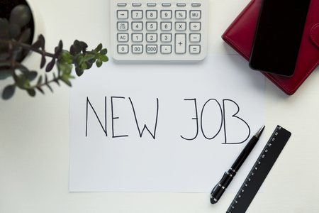 New Job concept with workplace on white wooden deskの写真素材