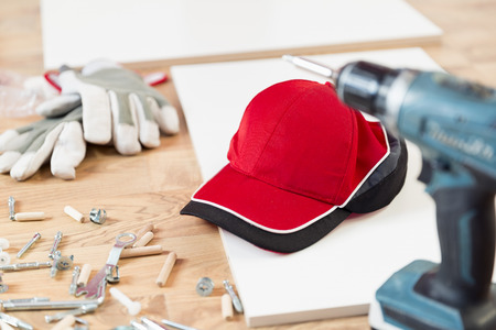 Furniture assembly parts and tools for self assembly furniture, on the floorの写真素材