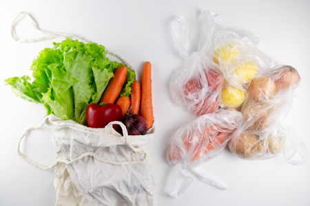 Zero waste concept. Vegetables in a woven bag. Woven bag vs plastic bags.の写真素材