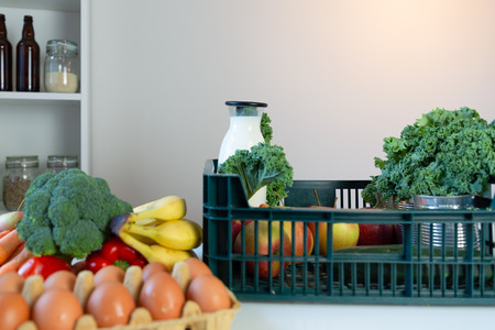 Fresh healthy groceries and vegetables from supermarket in green tray box. Food delivery serviceの写真素材