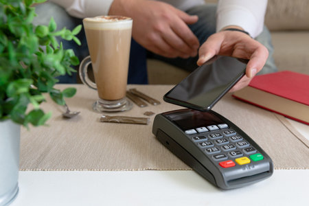 Customer making wireless or contactless payment using smartphone, nfc payment