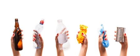 Different types of waste in the hands on a white background. Sort garbage and environment conceptの写真素材