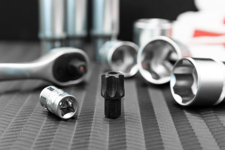 Car repair tools, wrench tool set on a black texture background