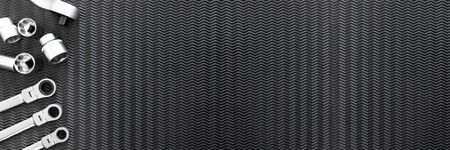 Car repair tools, wrench tool set on a black texture backgroundの写真素材