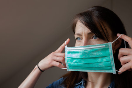 Women wearing a facial protction mask
