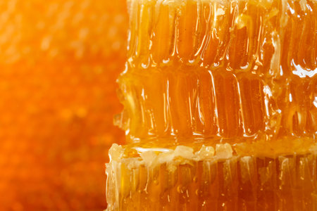 organic honey and rustic bread on a old wooden table. Healthy eating breakfast.