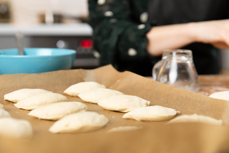 Women preparing homemade food pie, pizza in a cozzy kitchen. Hobbies and family life concept.