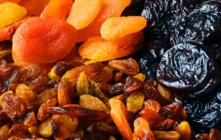 Dried fruits close-up, raisins, dried apricots, prunes, healthy nutritionの写真素材