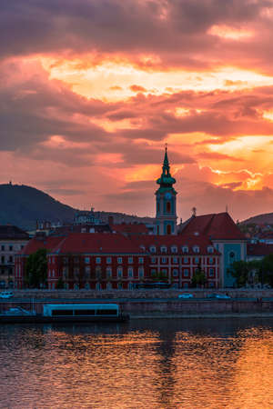 Hungary, spring cityscape of Budapest, church on the background of colorful sunsetの写真素材