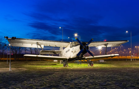 Small plane at the airport, against the background of a beautiful sky