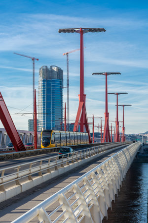 Yellow tram rides over the RÃ¡kÃ³czi bridge in Budapest, cityscapeの写真素材