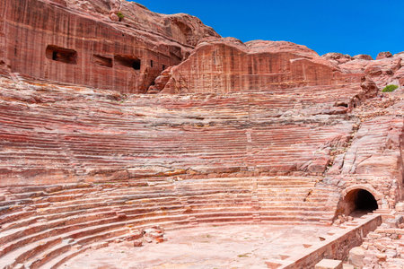 Jordan, ancient amphitheater in the city of Petra, daytime landscape