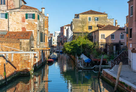 Morning in Venice, water channels along residential buildings, cityscapeの写真素材